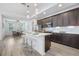 Modern kitchen with island, stainless steel appliances, and white quartz countertops at 14269 Shocklach Dr, Winter Garden, FL 34787