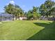 Large grassy backyard with plenty of space for outdoor activities at 714 Terranova Ave, Winter Haven, FL 33884