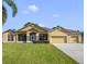 Attractive ranch-style home with a two car garage and well-manicured lawn at 714 Terranova Ave, Winter Haven, FL 33884