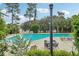 Refreshing community pool with lounge chairs and tables at 555 Orient Ave, Debary, FL 32713