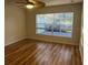 Bright bedroom with laminate wood flooring and large windows at 11872 Iselle Dr, Orlando, FL 32827