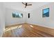 Bright bedroom with hardwood floors, windows, and ceiling fan at 1333 W Smith St, Orlando, FL 32804