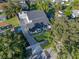 Aerial view of a renovated house with a large driveway and landscaped yard at 1333 W Smith St, Orlando, FL 32804