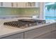 Stainless steel gas cooktop with griddle on kitchen island at 1333 W Smith St, Orlando, FL 32804