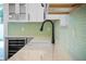 Black gooseneck faucet in modern kitchen at 1333 W Smith St, Orlando, FL 32804
