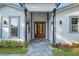 Inviting front entrance with a brown door and gray stone walkway at 1333 W Smith St, Orlando, FL 32804