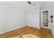 Bedroom with hardwood floors, double door closet, and window at 1333 W Smith St, Orlando, FL 32804