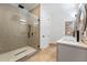 Modern bathroom with double vanity, glass shower, and tile flooring at 1333 W Smith St, Orlando, FL 32804