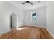 Light-filled bedroom with hardwood floors and private bath access at 1333 W Smith St, Orlando, FL 32804