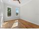 Well-lit bedroom with hardwood floors and multiple windows at 1333 W Smith St, Orlando, FL 32804