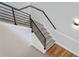 Modern staircase with black metal railing and gray tile treads at 1333 W Smith St, Orlando, FL 32804