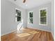 Bedroom with hardwood floors and large windows offering natural light at 1333 W Smith St, Orlando, FL 32804