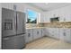 Modern kitchen with gray cabinets and quartz countertops at 1333 W Smith St, Orlando, FL 32804