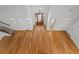 Two-story entryway showcasing hardwood floors and elegant light fixture at 1333 W Smith St, Orlando, FL 32804