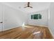 Spacious bedroom with hardwood floors and large window at 1333 W Smith St, Orlando, FL 32804