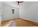 Well-lit bedroom, featuring hardwood floors and a window at 1333 W Smith St, Orlando, FL 32804