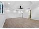 Bright bedroom with wood-look floors, a window, and a ceiling fan at 1333 W Smith St, Orlando, FL 32804