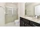 Bathroom with shower, toilet and dark brown vanity at 287 Jetty Way, Davenport, FL 33897