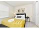Bright bedroom with a queen bed, nightstand, and window coverings at 287 Jetty Way, Davenport, FL 33897