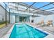 Private pool with patio furniture and grilling area at 287 Jetty Way, Davenport, FL 33897