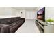 Spacious living room with sectional sofa and large TV at 287 Jetty Way, Davenport, FL 33897