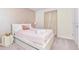 Bedroom with a full-size bed and rose gold accents at 287 Jetty Way, Davenport, FL 33897