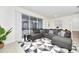 Open living room showcasing a sectional sofa, large windows, and access to a pool at 287 Jetty Way, Davenport, FL 33897