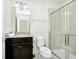 Clean bathroom with shower, toilet, vanity, and granite countertop at 287 Jetty Way, Davenport, FL 33897