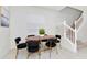 Small dining area with a round table and six black chairs at 287 Jetty Way, Davenport, FL 33897