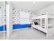 Bedroom with bunk beds and superhero-themed wallpaper at 287 Jetty Way, Davenport, FL 33897