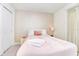 Bedroom with a full-size bed and rose gold accents at 287 Jetty Way, Davenport, FL 33897
