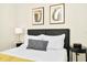 Bedroom with a queen bed, nightstand, and decorative pillows at 287 Jetty Way, Davenport, FL 33897