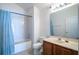 Clean bathroom with a shower/tub combo and wood vanity at 36711 Alaqua Ct, Eustis, FL 32736