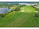Golf course with lake and green fairways at 4538 Nottoway Dr, Leesburg, FL 34748