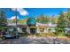 Restaurant with outdoor seating and golf cart parking at 4538 Nottoway Dr, Leesburg, FL 34748