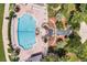 Resort-style pool with surrounding lounge chairs and landscaping at 4538 Nottoway Dr, Leesburg, FL 34748