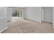 Bright living room with sliding doors and neutral decor at 4538 Nottoway Dr, Leesburg, FL 34748