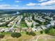 Community overview showing many houses and a lake at 4538 Nottoway Dr, Leesburg, FL 34748