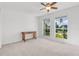 Bedroom with wood desk and large windows at 968 Moss Tree Pl, Longwood, FL 32750