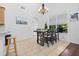 Dining area with hardwood floors and a chandelier at 968 Moss Tree Pl, Longwood, FL 32750