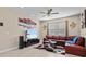 Spacious living room with a large sectional sofa and wall-mounted TV at 528 Bellissimo Pl, Howey In The Hills, FL 34737