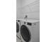 Laundry room with modern washer and dryer at 528 Bellissimo Pl, Howey In The Hills, FL 34737