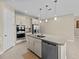 Modern kitchen with stainless steel appliances and granite countertops at 528 Bellissimo Pl, Howey In The Hills, FL 34737
