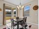 Bright breakfast nook with sliding glass doors leading to backyard at 528 Bellissimo Pl, Howey In The Hills, FL 34737