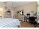 Bedroom with striped bedding and built-in workspace at 1150 N Hampton Dr, Davenport, FL 33897