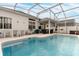 Inviting screened-in pool with patio and seating at 1150 N Hampton Dr, Davenport, FL 33897