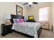 Bedroom with floral bedding and ceiling fan at 1150 N Hampton Dr, Davenport, FL 33897