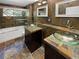 Updated bathroom with double vanity, glass sinks, and slate tile at 1711 Shadow View Cir # 1711, Maitland, FL 32751