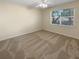 Spacious bedroom with neutral walls and carpeting at 1711 Shadow View Cir # 1711, Maitland, FL 32751