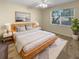 Bright bedroom with large window and light colored walls at 1711 Shadow View Cir # 1711, Maitland, FL 32751